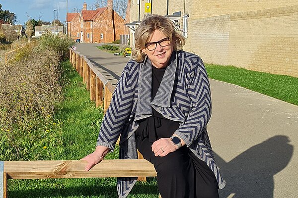 Lib Dem Ely North Candidate Alison Whelan sat near a swale